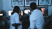 Two radiologists in a reading room.